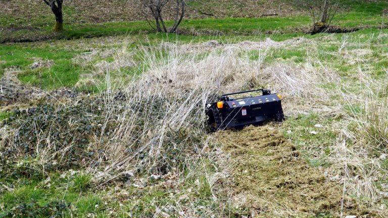 remote controlled mower with snow plow snow blade snow shovel snow removal machine