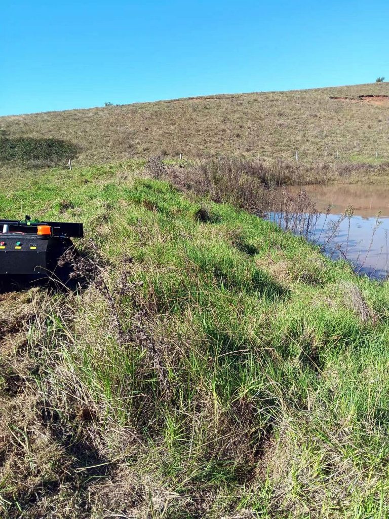 remotely controlled mowing robot with snow plow snow blade snow shovel snow removal machine